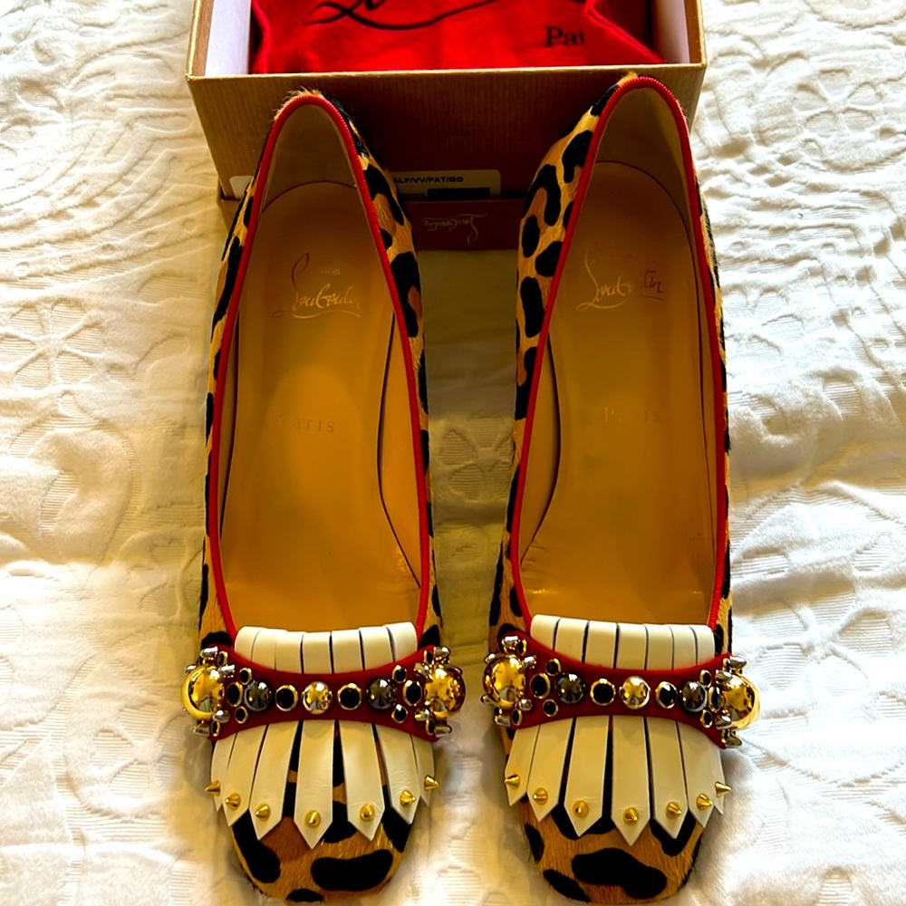 - Louboutin shoes animal print new never worn